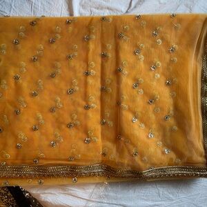 Mustard yellow / orange net sari with golden work